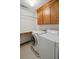 Functional laundry room with washer, dryer, overhead cabinets, and counter space at 204 William St, Mount Pleasant, SC 29464
