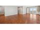 Spacious living area with hardwood floors and a view of the balcony at 204 William St, Mount Pleasant, SC 29464