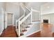 Elegant staircase with white railings and hardwood floors at 204 William St, Mount Pleasant, SC 29464