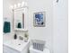 Clean bathroom with vanity sink, framed art, and stylish storage basket at 21 Hester St # 2, Charleston, SC 29403