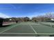 Well-maintained tennis court with green surface, net in place, and clear blue sky above at 21 Hester St # 2, Charleston, SC 29403