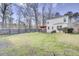 Beautiful backyard with lush green grass, patio, and well-maintained landscaping at 211 Tall Grass Ct, Summerville, SC 29483