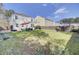 Beautiful backyard with lush green grass, patio, and well-maintained landscaping at 211 Tall Grass Ct, Summerville, SC 29483