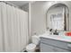Well-lit bathroom featuring a vanity with white countertop and a stylish arch mirror at 211 Tall Grass Ct, Summerville, SC 29483