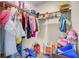 Walk-in closet filled with clothing and accessories at 211 Tall Grass Ct, Summerville, SC 29483