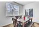 Cozy dining room with a window view, featuring wood-look flooring and comfortable seating at 211 Tall Grass Ct, Summerville, SC 29483