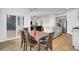 Bright dining area flowing into the kitchen, with sliding doors to the patio and an inviting atmosphere at 211 Tall Grass Ct, Summerville, SC 29483