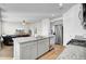 Open-concept kitchen boasts granite countertops, stainless steel appliances, and seamless flow to the living room at 211 Tall Grass Ct, Summerville, SC 29483