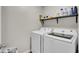 Laundry room with modern white washer and dryer at 211 Tall Grass Ct, Summerville, SC 29483