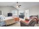 Serene main bedroom with ceiling fan, ample natural light, and ensuite bathroom access at 211 Tall Grass Ct, Summerville, SC 29483