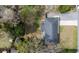Aerial view of home with a spacious backyard, patio area, long driveway, and mature trees at 2137 Barbour Dr, Charleston, SC 29414