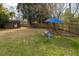 Large backyard with a shed, mature trees, lounge chair, and shady spaces at 2137 Barbour Dr, Charleston, SC 29414
