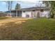 Backyard featuring white painted brick, a screened porch, a grill, and a wooden fence at 2137 Barbour Dr, Charleston, SC 29414