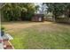 Spacious backyard featuring a storage shed, mature bamboo, and ample grassy space at 2137 Barbour Dr, Charleston, SC 29414