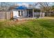 Charming backyard patio with a blue umbrella and outdoor seating, perfect for relaxing at 2137 Barbour Dr, Charleston, SC 29414