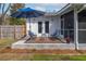 Backyard patio featuring a blue umbrella and comfortable seating area at 2137 Barbour Dr, Charleston, SC 29414