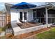 Inviting backyard patio area with a blue umbrella and outdoor furniture at 2137 Barbour Dr, Charleston, SC 29414