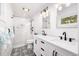 Modern bathroom with glass shower, double vanity, and stylish black and white tile floor at 2137 Barbour Dr, Charleston, SC 29414