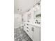 Modern bathroom with glass shower, double vanity, and stylish patterned tile floor at 2137 Barbour Dr, Charleston, SC 29414