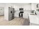 Modern kitchen featuring white cabinets, subway tile backsplash, and stainless steel appliances at 2137 Barbour Dr, Charleston, SC 29414