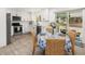 Kitchen with dining area featuring stainless steel appliances, white cabinets and natural light at 2137 Barbour Dr, Charleston, SC 29414