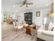 Open-concept living room with dining area featuring hardwood floors, stylish furniture, and bright lighting at 2137 Barbour Dr, Charleston, SC 29414
