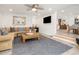 Open living room with stylish decor and a large rug, leading into the kitchen and dining area at 2137 Barbour Dr, Charleston, SC 29414