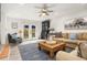 Cozy living room with comfortable seating, french doors to backyard and wood accents at 2137 Barbour Dr, Charleston, SC 29414