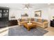 Comfortable living room with a plush sofa, area rug, and a view of the backyard at 2137 Barbour Dr, Charleston, SC 29414