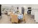 Open living space with a dining area and an adjacent kitchen featuring modern appliances at 2137 Barbour Dr, Charleston, SC 29414