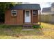 Charming backyard storage shed with a window box and porch at 2137 Barbour Dr, Charleston, SC 29414