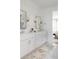 Well-lit bathroom boasting a double vanity, modern fixtures, a glass-enclosed shower, and access to the serene main bedroom at 2151 Arthur Rose Ln, Johns Island, SC 29455