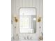 Bathroom featuring double sinks, marble countertops, stylish mirrors, sconces and a bathtub with a glass shower panel at 2151 Arthur Rose Ln, Johns Island, SC 29455