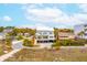 Stunning coastal home with outdoor balconies and surrounding beach community at 220 W Arctic Ave, Folly Beach, SC 29439