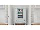 Organized closet with a unique cabinet for linens and built-in shelving at 220 W Arctic Ave, Folly Beach, SC 29439