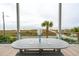 Relaxing outdoor dining area with a table and seating, offering stunning views of the ocean at 220 W Arctic Ave, Folly Beach, SC 29439