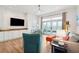 Spacious living room with coastal decor, large windows, and ocean views; perfect for relaxing and entertaining at 220 W Arctic Ave, Folly Beach, SC 29439