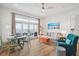 Coastal living room with ocean view, comfortable seating, and light wood floors at 220 W Arctic Ave, Folly Beach, SC 29439