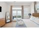 Bright bedroom featuring balcony access, ocean views, and comfortable bed at 220 W Arctic Ave, Folly Beach, SC 29439