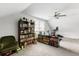 Spacious finished attic features natural light, ceiling fan, and large bookcases at 2312 Oakland Rd, Charleston, SC 29414