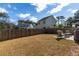 Spacious backyard with a privacy fence and patio seating area, perfect for outdoor entertaining at 2312 Oakland Rd, Charleston, SC 29414
