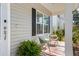 Inviting covered front porch featuring stylish seating and a cozy, welcoming atmosphere at 2312 Oakland Rd, Charleston, SC 29414
