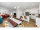 Open-concept living area with hardwood floors, stylish furnishings, and a seamless flow from kitchen to living room at 2312 Oakland Rd, Charleston, SC 29414