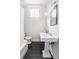 Bathroom with tiled floor, pedestal sink, and large mirror at 244 Ashley Ave, Charleston, SC 29403
