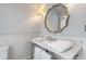 Bathroom features marble countertop and detailed mirror at 244 Ashley Ave, Charleston, SC 29403