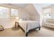 Bedroom with soft lighting, carpeted floors, and two large windows with woven shades at 244 Ashley Ave, Charleston, SC 29403