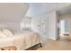 Bedroom featuring ensuite bathroom, neutral tones, and lots of natural light at 244 Ashley Ave, Charleston, SC 29403