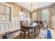 Dining area featuring natural light and traditional decor, creating a warm and inviting atmosphere at 244 Ashley Ave, Charleston, SC 29403