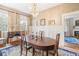 Bright and spacious dining room with a chandelier and paneled walls, perfect for entertaining at 244 Ashley Ave, Charleston, SC 29403