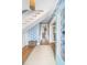 Welcoming entryway featuring blue floral wallpaper, hardwood floors, and a staircase at 244 Ashley Ave, Charleston, SC 29403